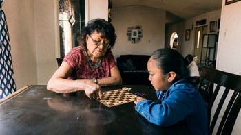 senior health: senior woman playing boardgame 1395938899