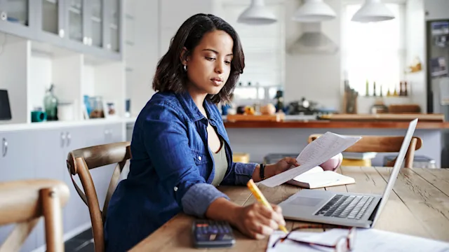 fsa hsa: woman working on finances 875247398