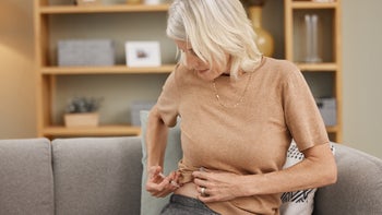 Health: Stelara: woman injecting in stomach 1334958275