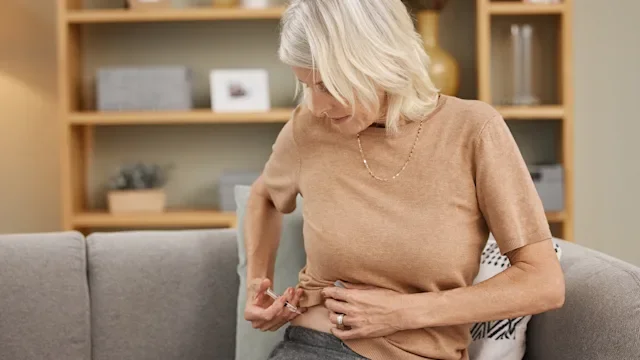 Health: Stelara: woman injecting in stomach 1334958275