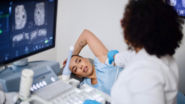 A patient getting a breast ultrasound exam.