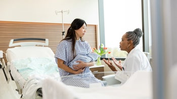 Sexual-health: doctor speaking to new mother 1494852326