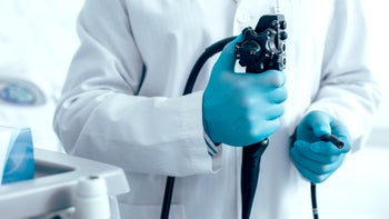Health: Diagnostics: closeup doctor holding endoscope-1217839625