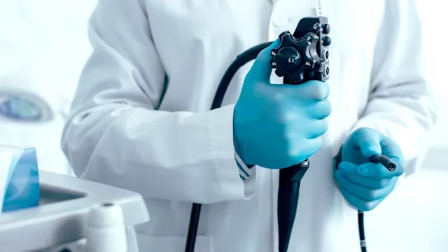Health: Diagnostics: closeup doctor holding endoscope-1217839625