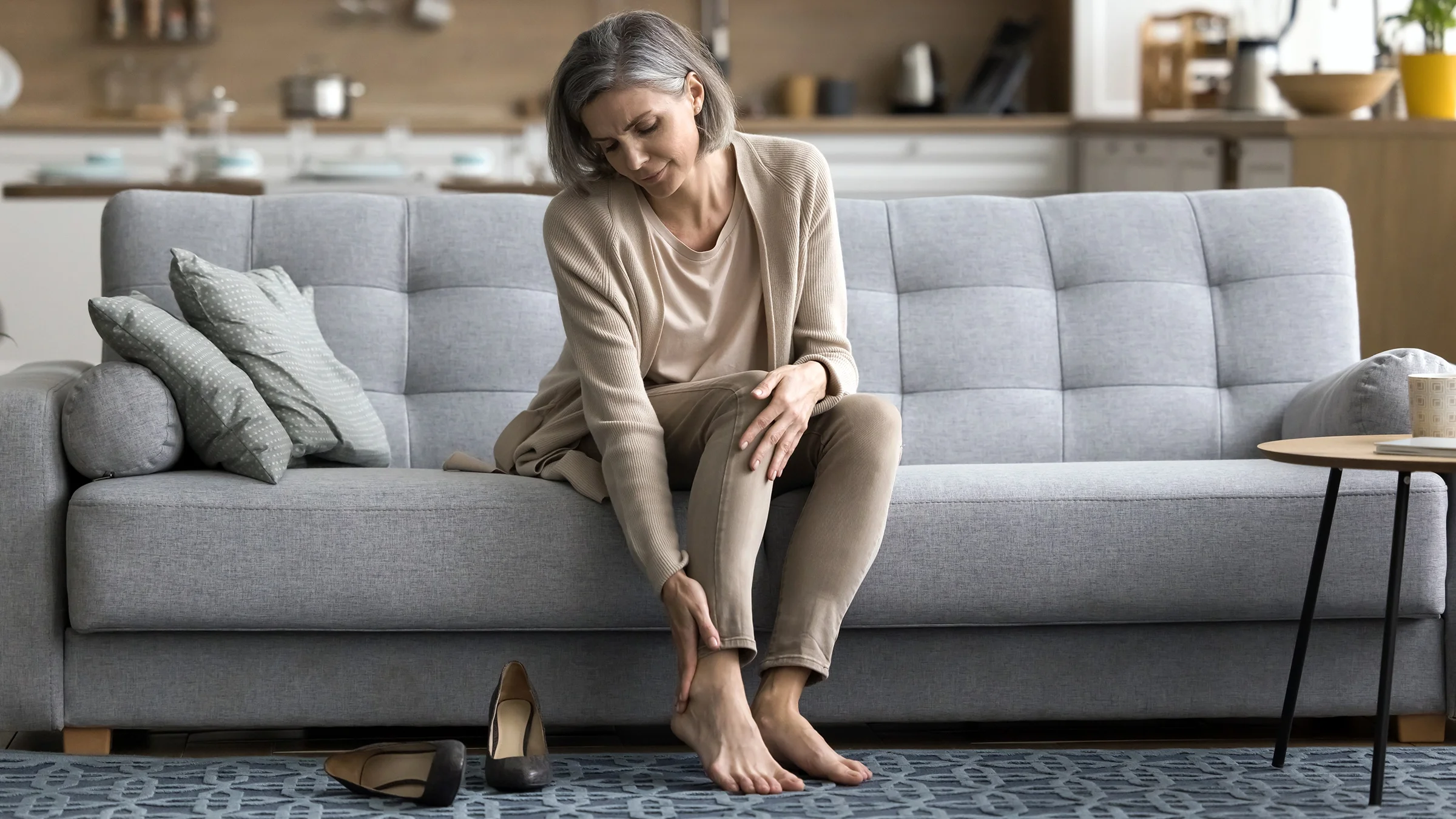 Woman feeling discomfort after wearing high heels