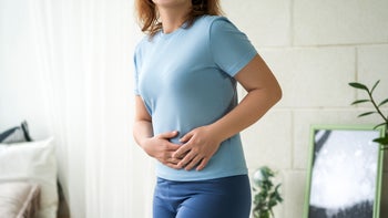 UTI: closeup woman with stomach pain 1478064546