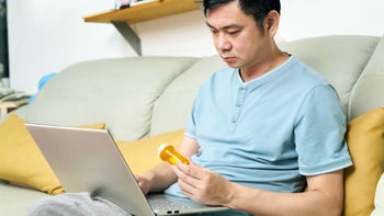Health: Mental health: man researching medication on laptop 1426951856