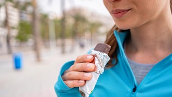 Womens health: woman eating a chocolate bar 2163494024