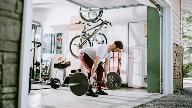 movement-exercise: man doing deadlift exercise 1219265873