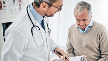 Health: Non hodgkins lymphoma: doctor consulting with senior patient 1152828187