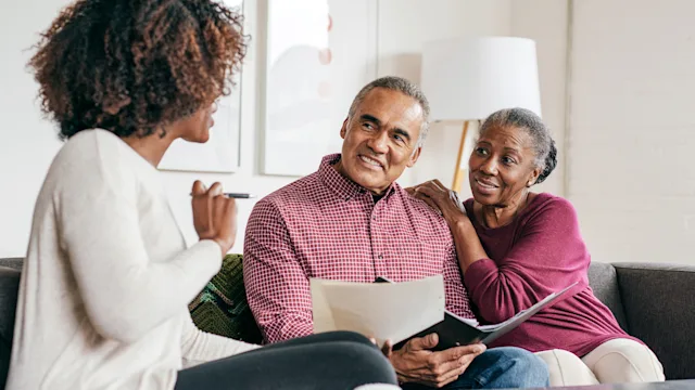 End-of-life: senior couple receiving advice 1053987352