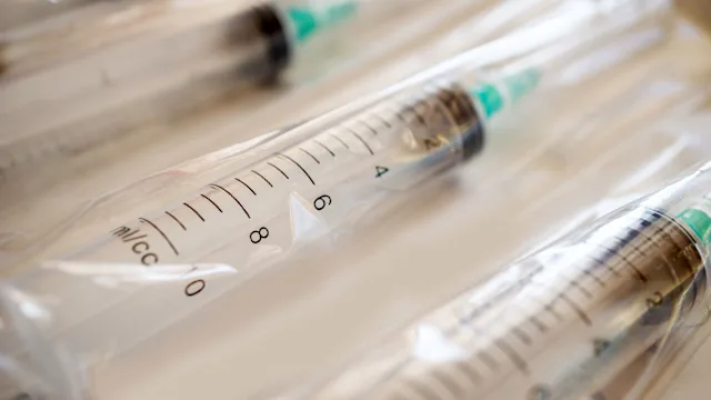 Health: Substance use disorder: closeup packaged syringe needles 943792418