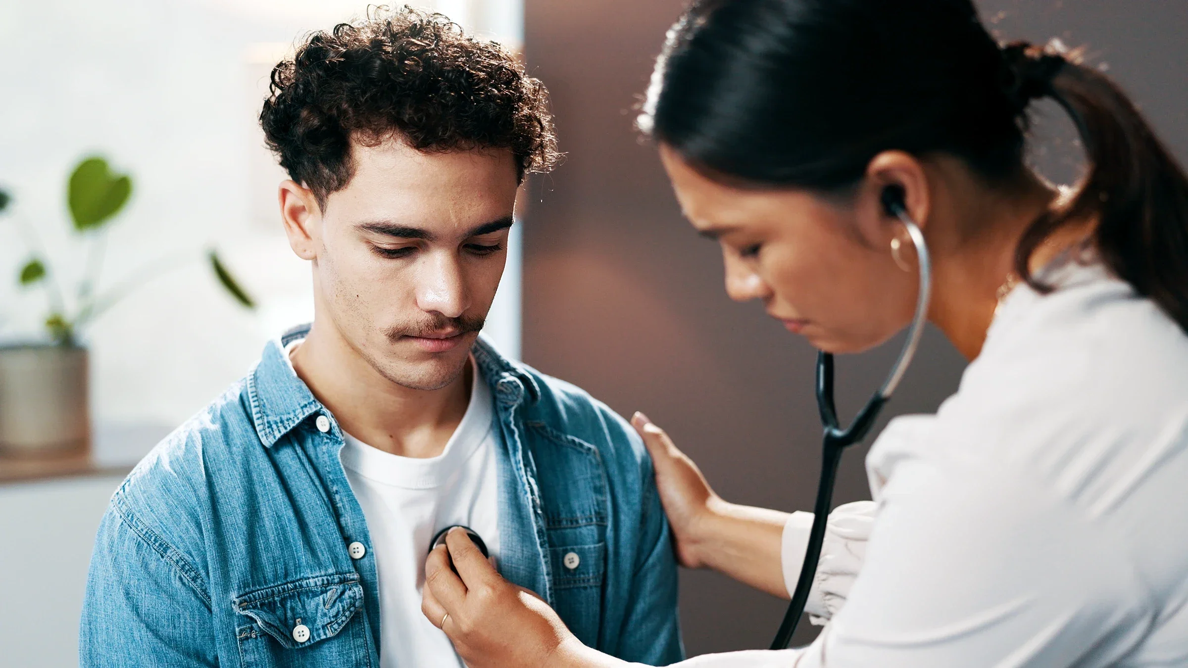 Healthcare professional using a stethoscope on a patient.
Jacob WackerhauseniStock via Getty Images Plus