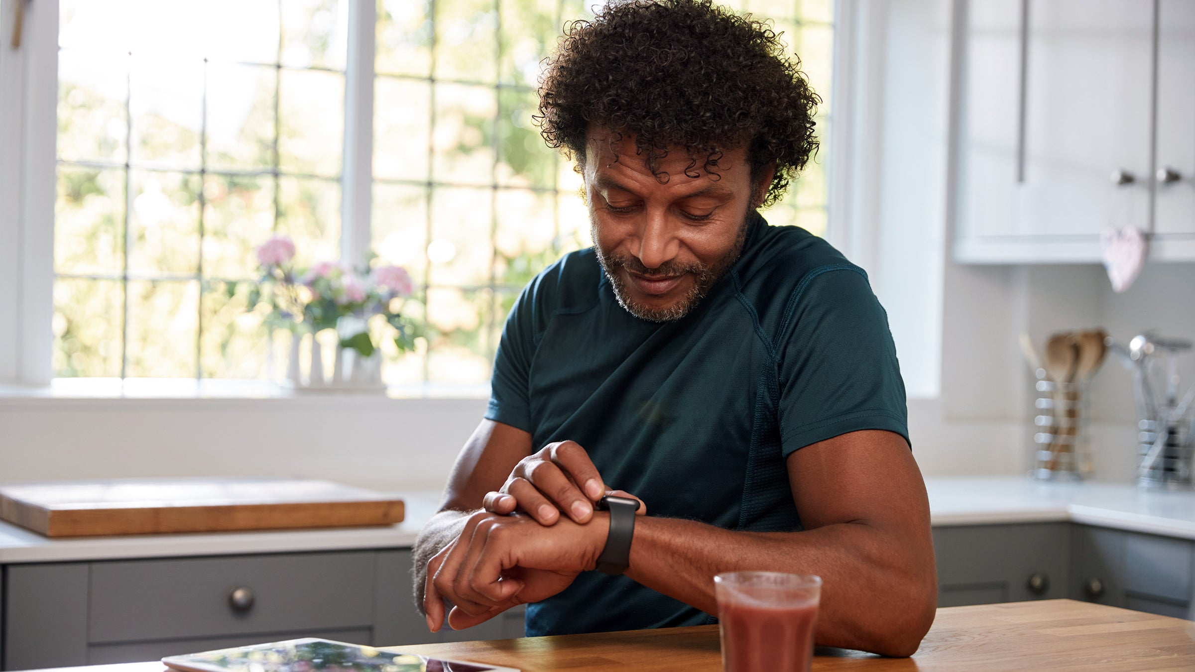 diabetes: man looking at smartwatch 1315157647