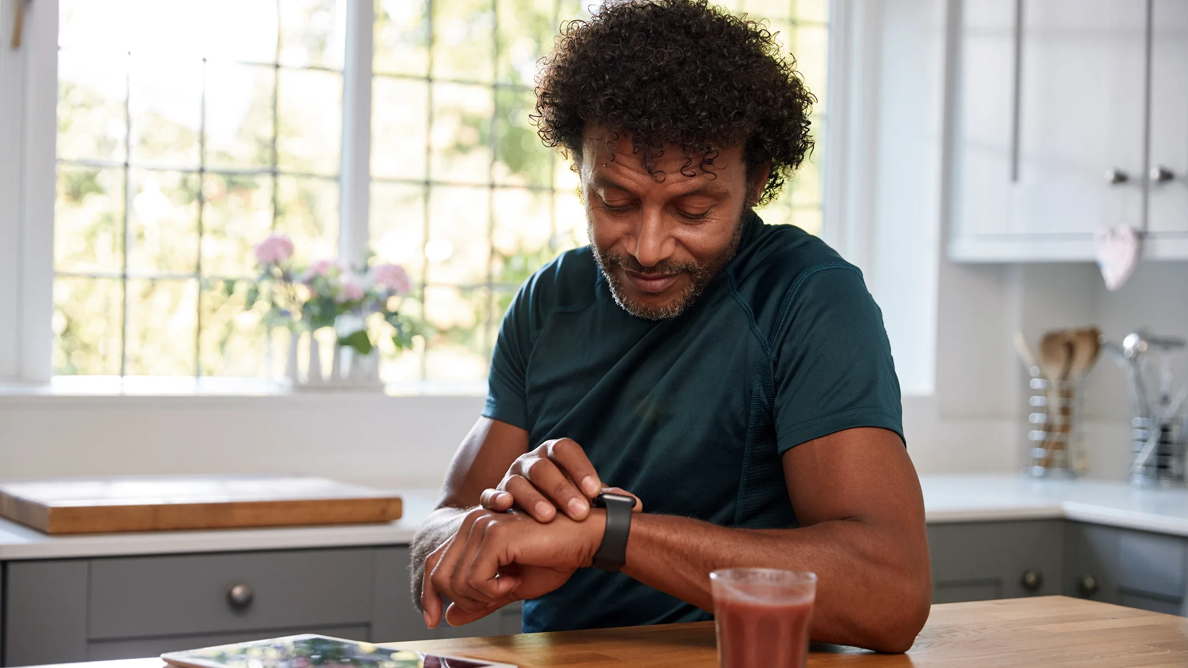 A man is pictured looking at his smartwatch.
monkeybusinessimages/iStock via Getty Images Plus