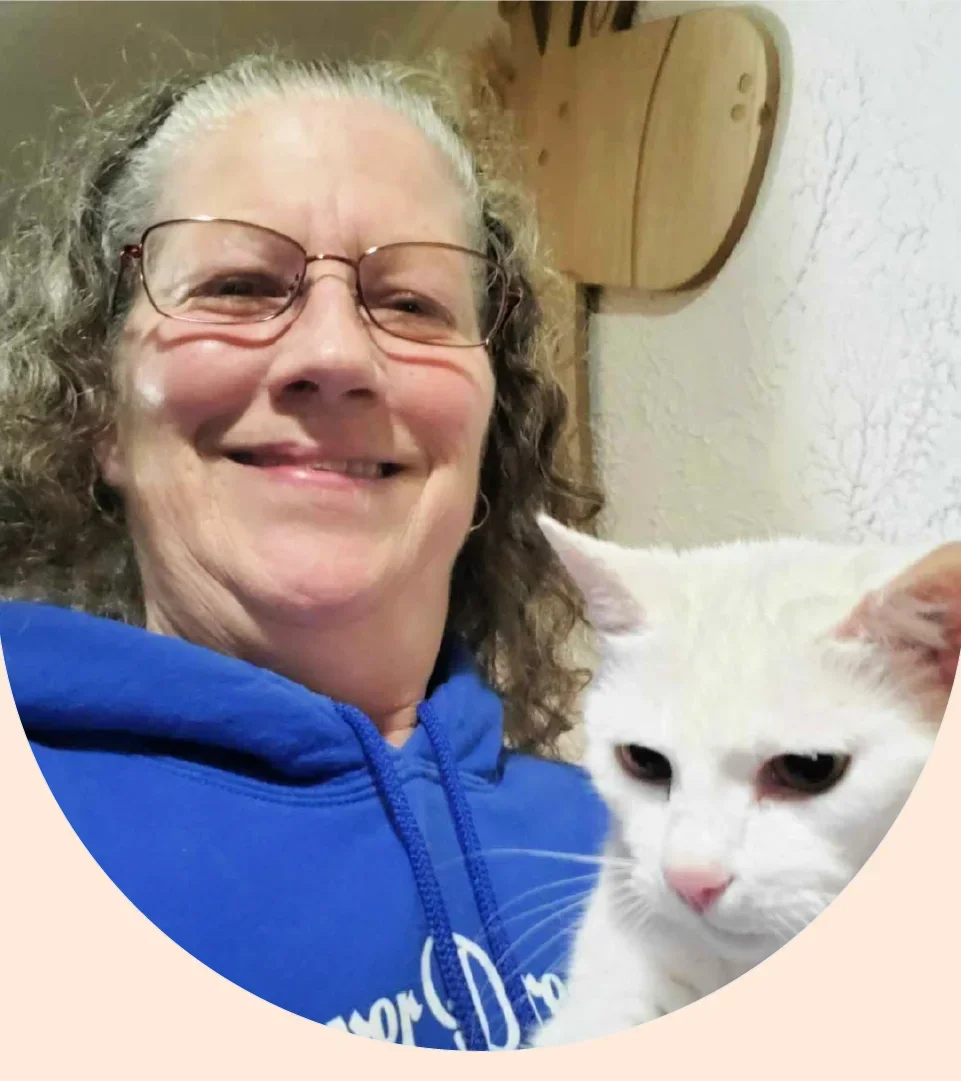 Pam Amicarella is pictured in a snapshot with her cat.