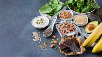 Health: Supplements and herbs: assorted magnesium rich foods textured background 801110034