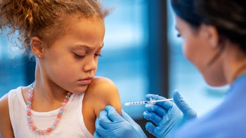Vaccines: child receiving vaccine 1199735132