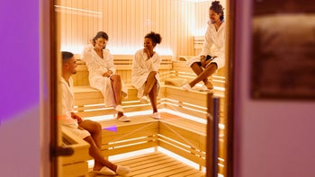 alternative-treatments: people relaxing inside infrared sauna 1809393246