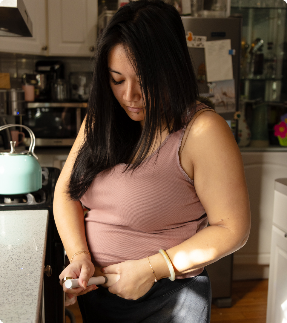 Larisa Courtien is pictured taking her Wegovy injection at her home in Forest Hills, Queens, New York.