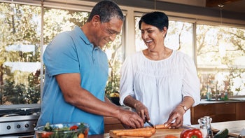 Procedures: senior couple cutting carrots 1754123140