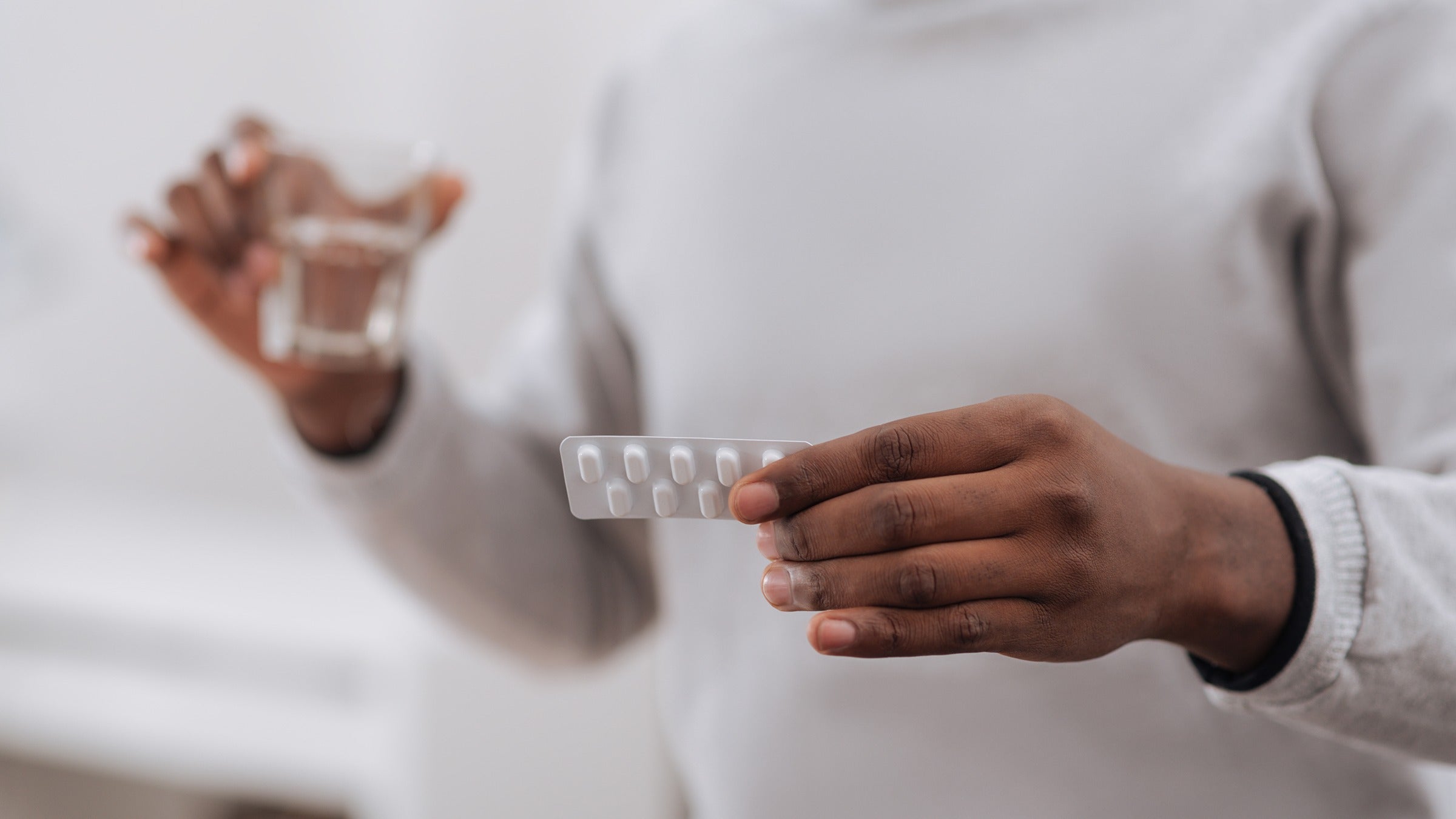 closeup man holding medicine pack 698025480