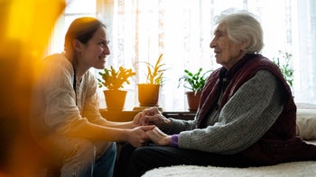 Caregiving: caregiver with senior 1470789115