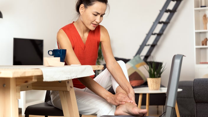 Woman with ankle pain