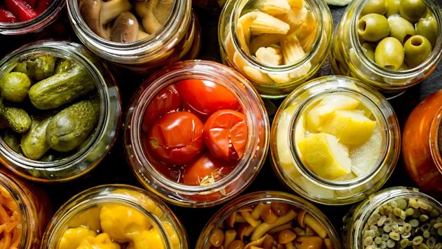 Diet Nutrition: Gut Health: closeup pickled vegetable jars 1155951289