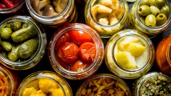 Diet Nutrition: Gut Health: closeup pickled vegetable jars 1155951289