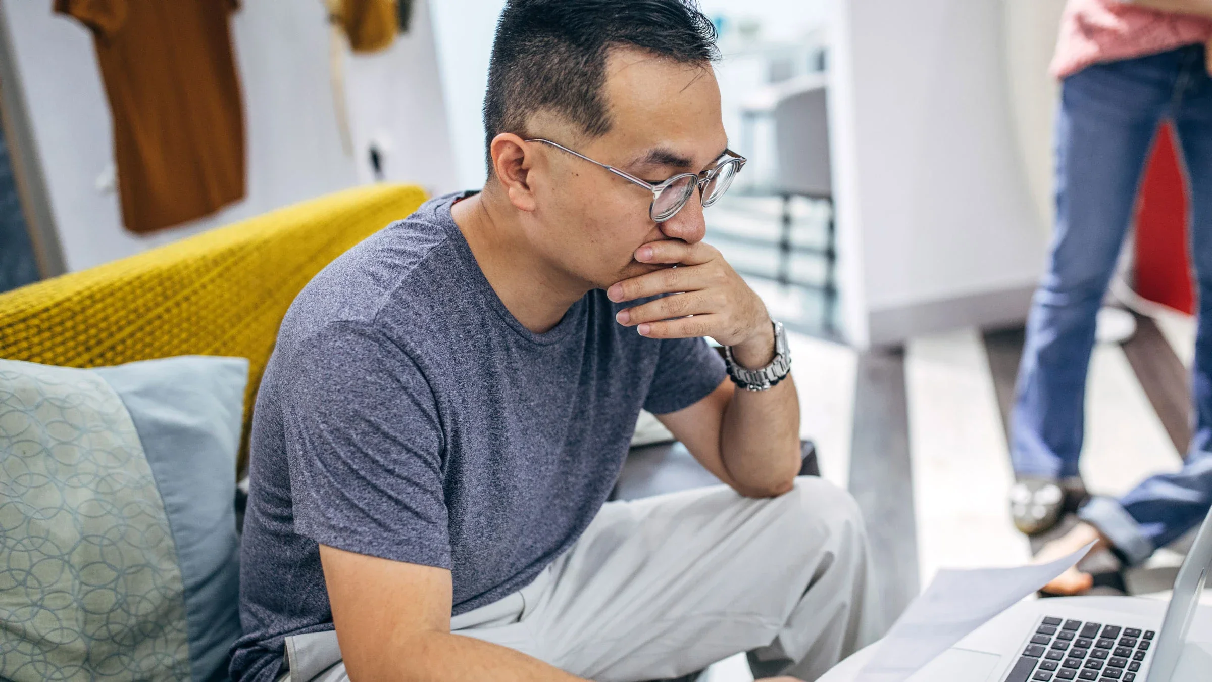 Man at home with laptop and paperwork
South_agency/E+ via Getty Images