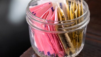 Diet and nutrition: closeup bowl assorted artificial sweeteners 1203392811