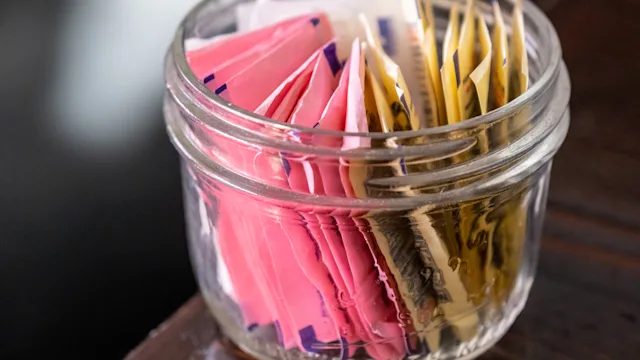Diet and nutrition: closeup bowl assorted artificial sweeteners 1203392811