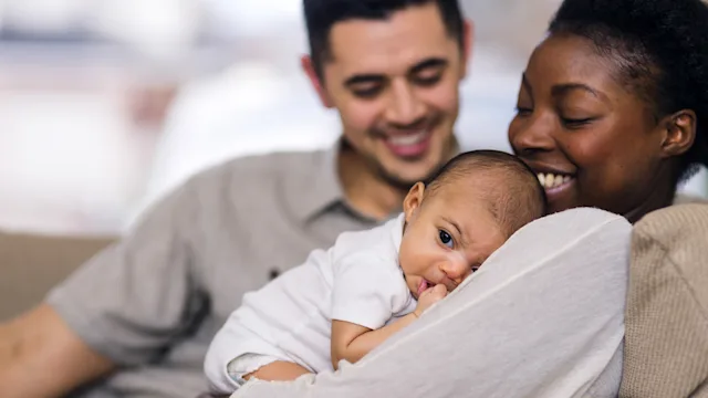 Fertility: mother holding newborn baby 901666764