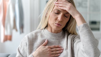 Health: Heart: woman with chest pain 1480143516