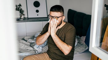 Allergies: man blowing his nose 1370355943