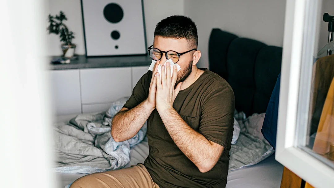 Allergies: man blowing his nose 1370355943