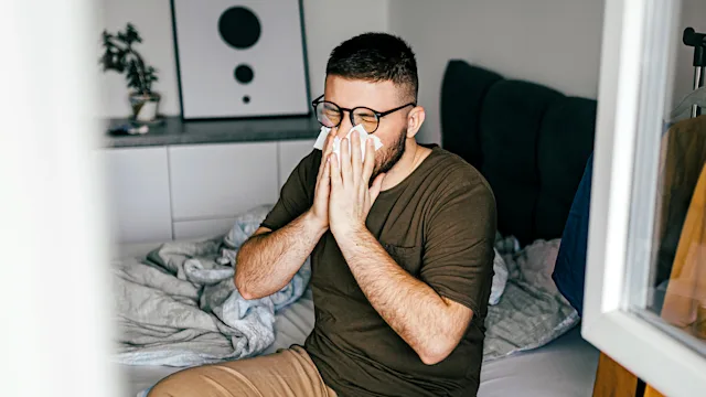 Allergies: man blowing his nose 1370355943