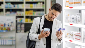 Health: Constipation: man comparing otc medicine 1413317935