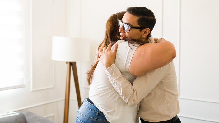 Patient hugging her therapist after a therapy session