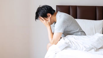aripiprazole: man upset in bedroom 1480813954