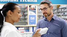A man speaks to a pharmacist about an over-the-counter medication.
Dean Mitchell/E+ via Getty Images 