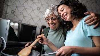 Diet nutrition: granddaughter cooking with grandmother 1395404831