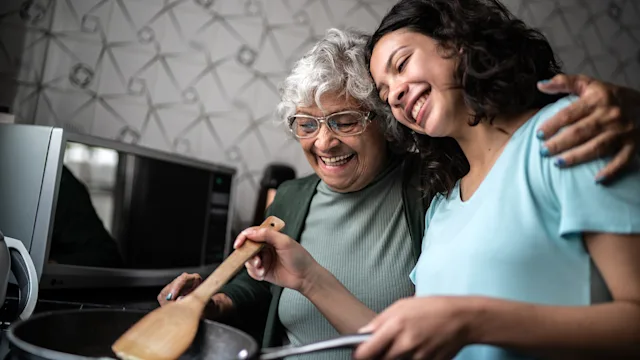 Diet nutrition: granddaughter cooking with grandmother 1395404831