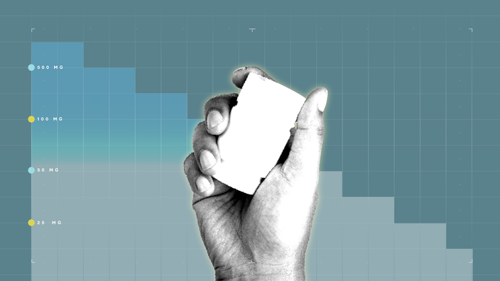 Dark blue-gray background with graph paper texture and representative step graph. In the center is a black-and-white cutout of a hand holding a white pill bottle. 