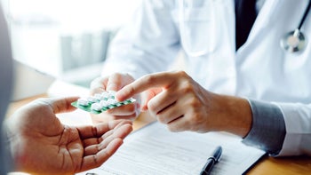 phentermine: Interactions: close up doctor and patient with medicine 1169928112