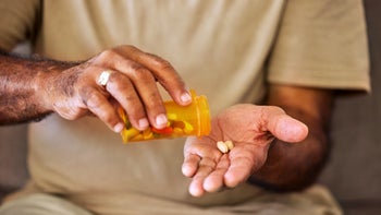 Health: Metformin: closeup pill in palm of hand 1432338461