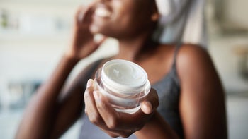 Health: Skincare: woman using face cream 1280518490