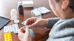 Close-up woman sorting through daily meds.
RECVISUAL/E+ via Getty Images
