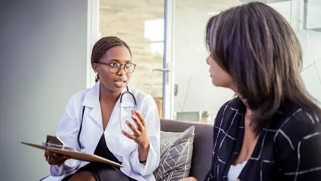 doctor explaining to patient 1320789641